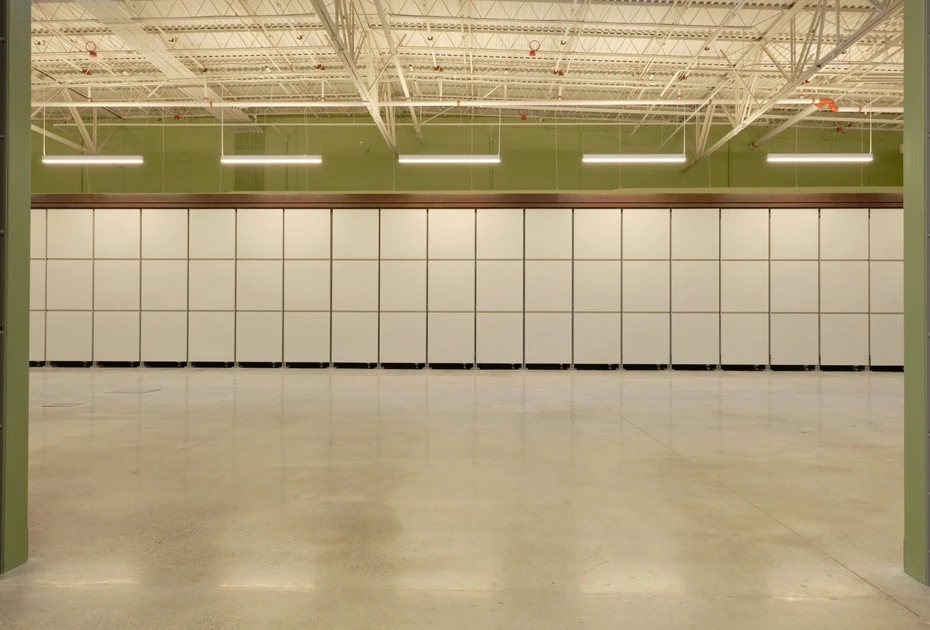 A modern, beautiful room containing vessels in Earth Funeral’s state-of-the-art human composting facility